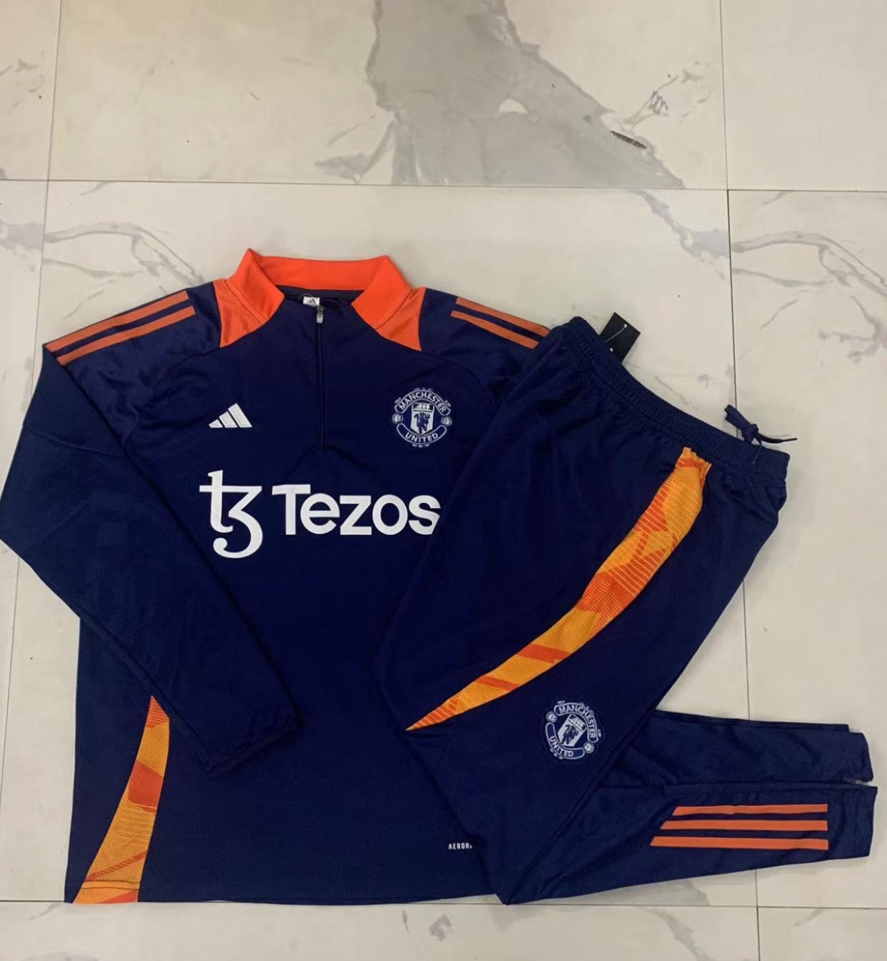Manchester United 24/25 Kids 1/4 Zip Tracksuit